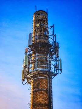Brick chimney with cellular antennas Фото