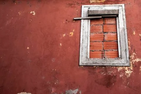 Brick closed window in an old red house Stock Photos