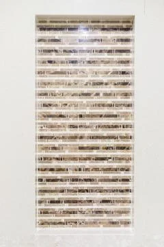 A brick design different level in a bathroom wall Stock Photos