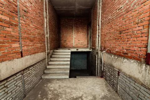 Brick empty room close-up. Unfinished room. Stock Photos