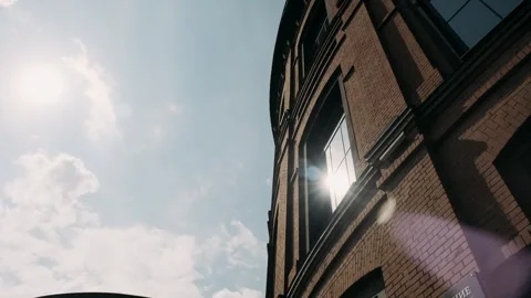 Brick facade of a building against a clear sky Stock Footage 282236913
