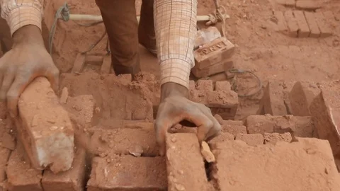 Brick field worker carrying complete finish brick Video stock 102579685
