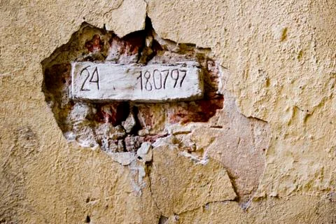 Brick with figures in the wall Stock Photos