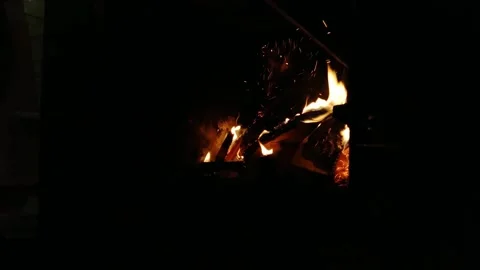 Brick fireplace with fire and firewood in the apartment Stock Footage 190532012
