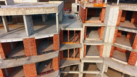 Brick frame of the future building. Drone footage along the hotel construction. Stock Footage 330117451