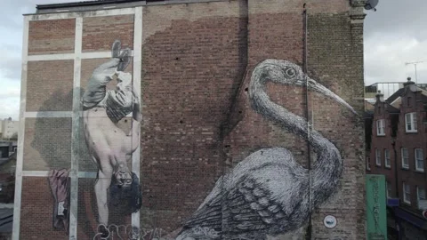 Brick gable wall of building in town, nice large art works Vídeos de archivo 167965393