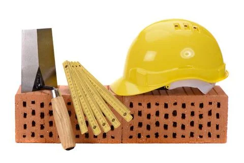 Brick for house construction and tools isolated over white background bric... Fotos de archivo