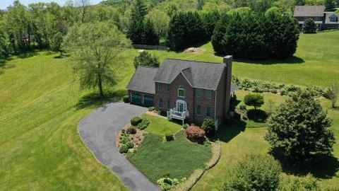 Brick house on a large plot of land Stock Photos