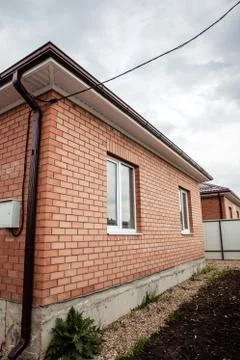 Brick house Wall Facade. construction of houses. cottage red brick house Stock Photos