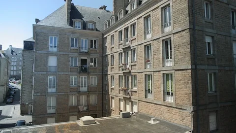 Brick houses facing an elevated pedestrian road Video stock 116528027
