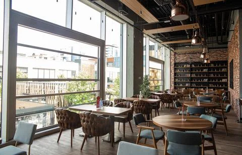 Brick interior of the restaurant in the daytime Stock Photos
