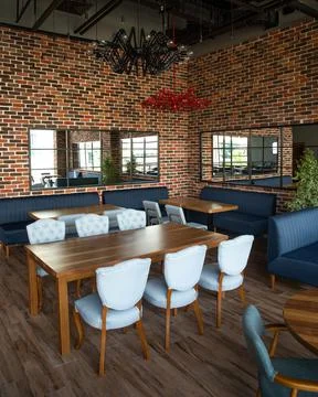 Brick interior of the restaurant in the daytime Stock Photos