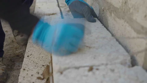 Brick Layer Lays Breeze Block On Mortar Stock Footage 239677848