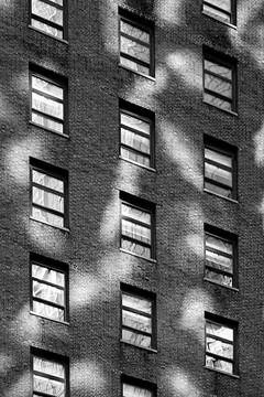 Brick, light and windows vertical bw Stock Photos