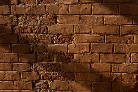 Brick loft wall in sunlight Stock Photos