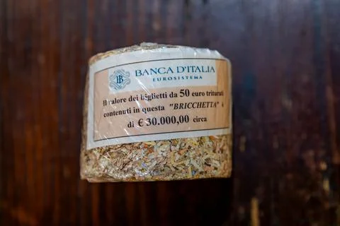 Brick made of shredded bank notes from the Banca d Italia in Florence, Italy Stock Photos
