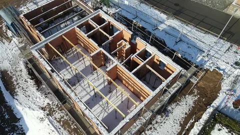 Brick masonry house under construction within a new residential housing Video stock 331619928