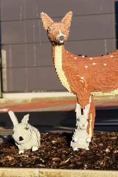 Brick models in front of the Lego Group company production factory building Stock Photos