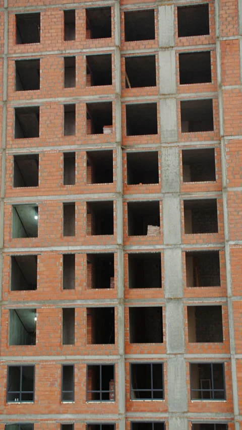 Brick Multi Story Building with Open Window Frames Stock Footage 296755365
