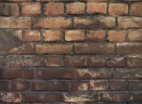 Brick old building wall with different colored bricks Fotos de archivo