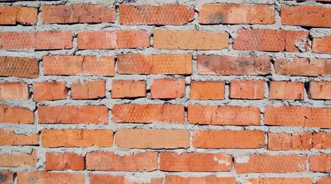 Brick old wall of uneven red brick Stock Photos