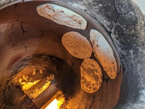 Brick oven baking bread 스톡 사진