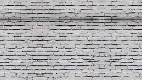 Brick pattern background repeats across textured geometric surface Video stock 328220687