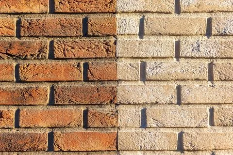Brick pattern divided in half into beige and brick color 스톡 사진