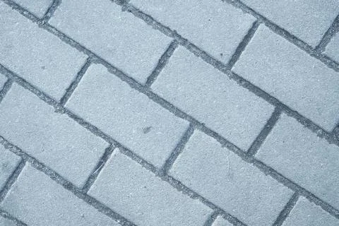Brick pavement pattern of blocks rectangular shape made of gray stone Stock Photos