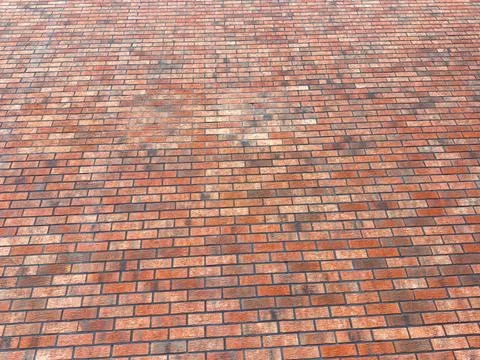 Brick pavement seen from above with different shades and textures Stock Photos