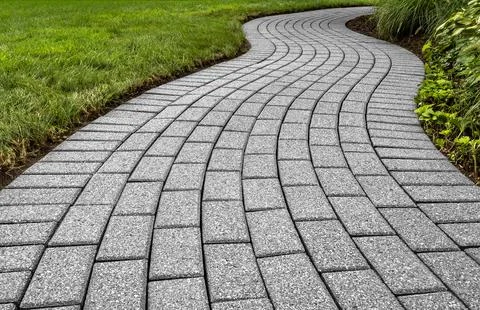 Brick pavers arranged in a curving pattern. Fotos Stock
