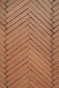 Brick paving with a herringbone pattern, road paved with red bricks, Italy Stock Photos