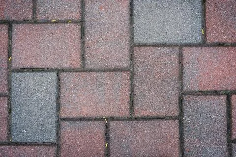 Brick paving stones on a sidewalk background texture Stock Photos