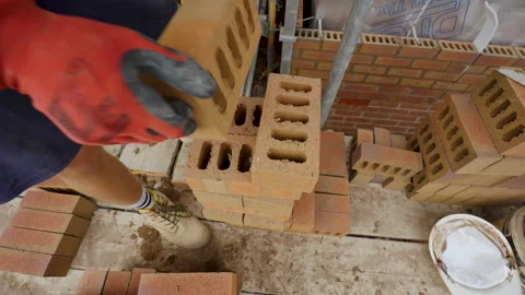 Brick Picked Up And Flipped Before Being Lifted Stock Footage 239679579