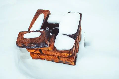 Brick pipe in the snow Stock Photos