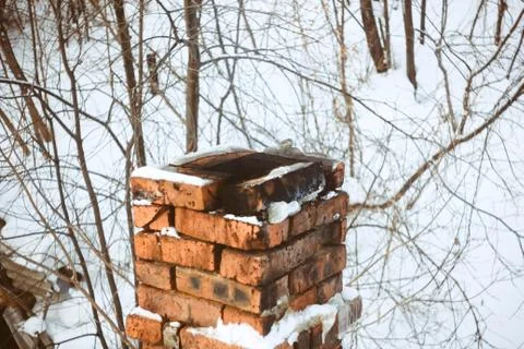 Brick pipe in the snow Stock Photos