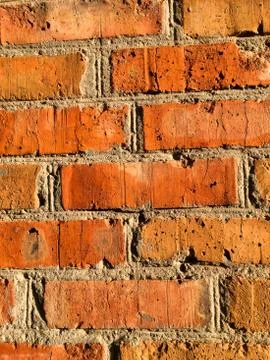 Brick red old wall. Bricks pattern. Close-up. Stock Photos