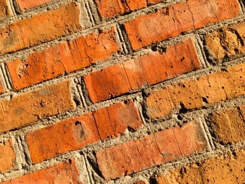 Brick red old wall. Bricks pattern. Grunge background. Stock Photos