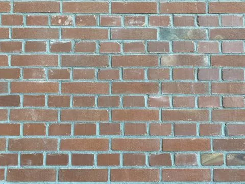 Brick red wall. background of a old brick house. Stock Photos
