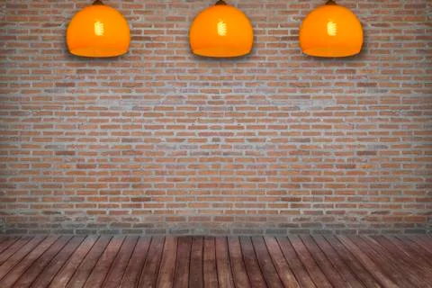 Brick room with ceiling lamp Stock Photos