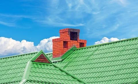 Brick smokestack on background sky Stock Photos
