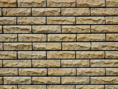 Brick stone wall background Brick stone wall background in warm hues Copyr... Foto stock