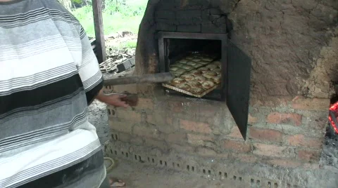 Brick stove baking bread Stock Footage 516785