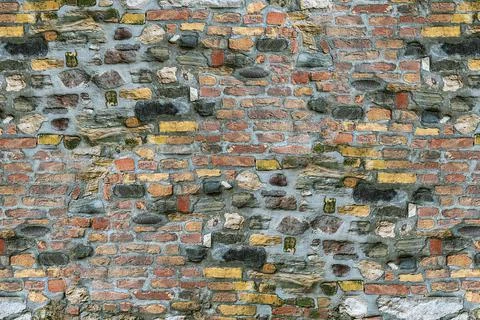 Brick texture background stone base colorful wall of the house Stock Photos