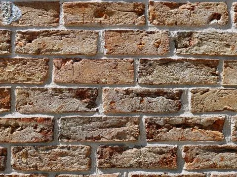 Brick texture with beige blocks and white seams Stock Photos
