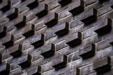 Brick texture facade. Brick texture with projecting geometric blocks. Modern Stock Photos