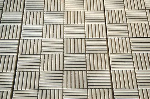 Brick texture footpath on walk with perspective going into the distance. Stock Photos