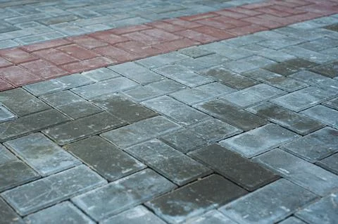 Brick texture footpath on walk with perspective going into the distance. Stock Photos