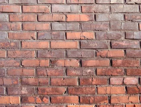 Brick texture. An old brick wall. Background. A day in the city. Stock Photos