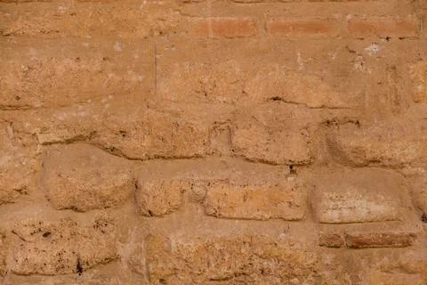 Brick texture old vintage background. Dirty aged and rust stone surface facade. Stock Photos